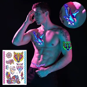 Vibrant fluorescent animal temporary tattoo stickers for arm and body glowing in UV