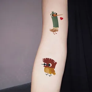 Set of colorful cartoon bird temporary tattoo stickers for kids on forearm display