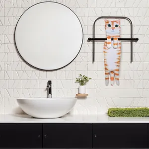 Creative orange tabby cat shaped hand towel hanging on a black rack in a modern bathroom