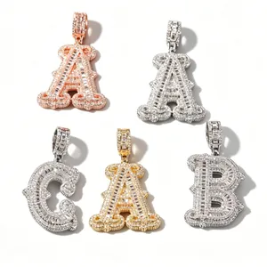 Detailed macro view of iced-out alphabet pendants in gold, silver and rose gold finishes