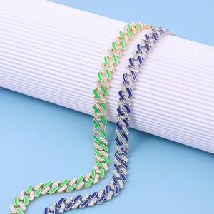 Detail view of 12mm iced out Cuban link chains with green and blue enamel coating