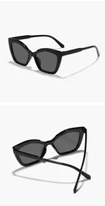 Detailed views of stylish black narrow cat-eye sunglasses from different angles.