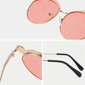 Stylish children's polarized sunglasses featuring gold metal frame and tinted pink lenses