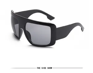 Side view of fashionable retro oversized black mask sunglasses with dark grey lenses