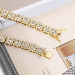 Detailed view of gold hip-hop bracelet with square links encrusted with sparkly crystals