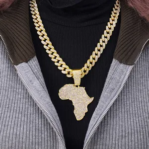 Close-up of iced out Africa map pendant on a gold Cuban link chain