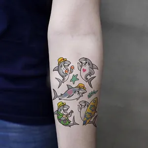 Cute cartoon shark temporary tattoos for kids with tropical ocean themes shown on arm