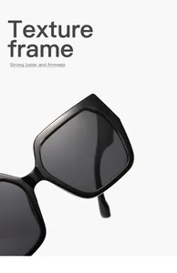 Close-up of high-quality black texture frame sunglasses with square cat-eye design.