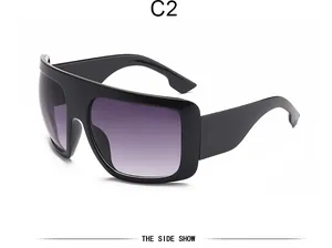 Close-up side view of oversized retro mask sunglasses featuring purple gradient lenses.