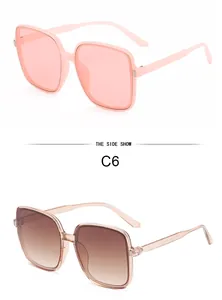 Side view of trendy oversized square sunglasses in pink and gradient tea colors