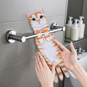 Creative and realistic orange tabby cat hanging hand towel shown on a bathroom towel rack