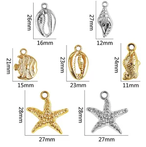 Detailed macro view of marine-themed gold and silver CCB pendants with precise dimensions.