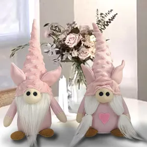 Set of two pink plush Valentine's Day gnomes with heart and soft texture