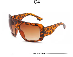 Detailed side view of trendy retro oversized leopard print shield mask sunglasses