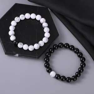 Elegante set van natuurstenen kralenarmbanden met howliet en zwarte onyx voor koppels