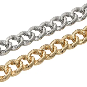 Close-up detail of 15mm textured Cuban link pet collars in shiny silver and gold