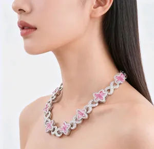 High-end silver Cuban link necklace with pink clover charms worn by Asian model