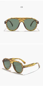 Detail view of men's large frame sunglasses with wood grain pattern and green lenses.