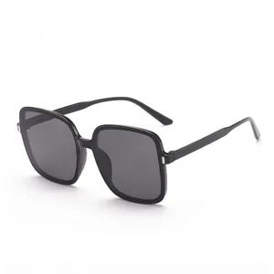 Trendy women's oversized square sunglasses featuring black frames and UV protective lenses