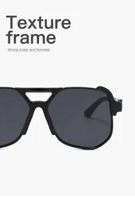 Detailed macro view highlighting the high luster texture frame of black pilot sunglasses