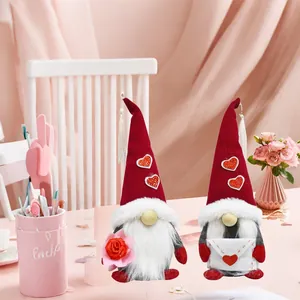 Pair of Mother's Day gnomes featuring heart sequins, holding a rose and an envelope