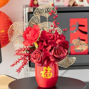 Festive red artificial flower arrangement in Fu character vase for New Year decor