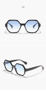 Close-up detail of retro polygonal sunglasses with light blue gradient lenses
