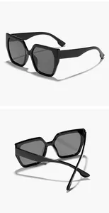 Detailed macro view showing the glossy black frame of these square cat eye sunglasses