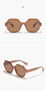Detailed view of translucent amber polygon sunglasses showing front and side profiles