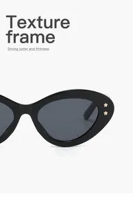 Detailweergave van ovale cat-eye zonnebril met unieke gouden sterrenstuds