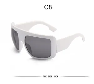 Side view of white oversized mask sunglasses with dark grey lenses