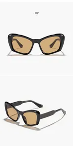 Vista detallada de gafas de sol cat-eye oversize con montura negra y lentes color té