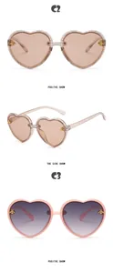 Close-up of heart-shaped kids' sunglasses with decorative gold-tone bee ornaments