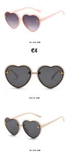 Detailed views of heart-shaped kids sunglasses with bee accents in pink and beige