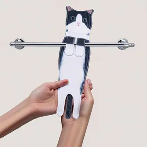 Close-up of a tuxedo cat-shaped hanging hand towel featuring absorbent fabric texture
