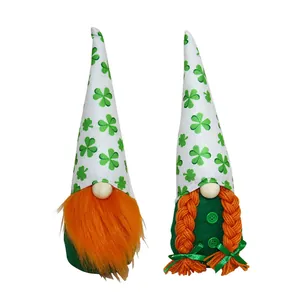 Pair of decorative St. Patrick's Day gnomes with green clover hats and orange hair