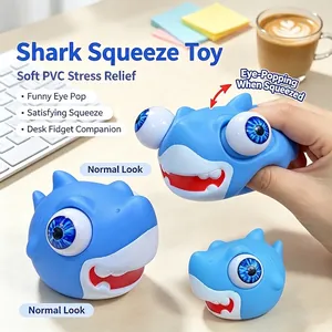 Blue eye-popping shark squeeze toy made of soft PVC for stress relief and fidgeting