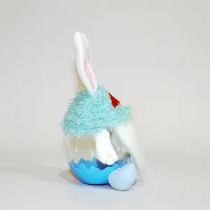 Side profile of a cute plush gnome bunny candy jar with light blue fuzzy hat and ears.