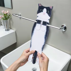 Close-up of a realistic black and white cat-shaped hanging hand towel in bathroom