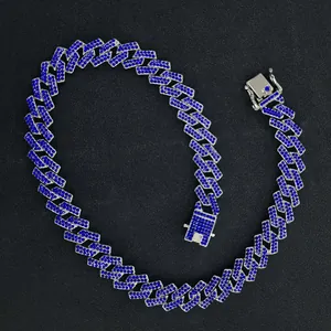 Macro detail of 15mm men's Cuban link necklace encrusted with vibrant blue rhinestones
