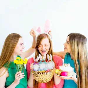 Detail view of Easter bunny gnome dolls held in a basket by cheerful girls