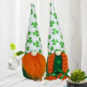 Pair of festive St. Patrick's Day gnomes featuring shamrock hats and orange braids