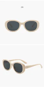 Vista dettagliata di occhiali da sole ovali retrò con montatura beige e lenti anti-UV