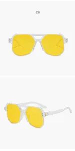 Front and side view of oversized aviator sunglasses with transparent frames and yellow lenses.