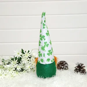 Detail view of St. Patrick's Day gnome with green shamrock pattern on a tall white hat
