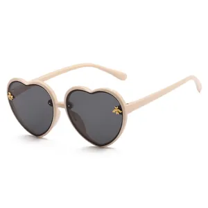 Retro cream heart-shaped sunglasses for kids featuring stylish gold bee lens decorations
