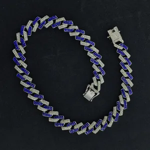 Close-up detail of 15mm silver Cuban link necklace with blue and white rhinestones for men