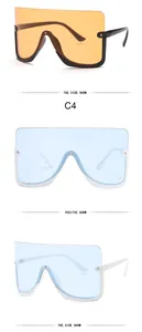 Detail of oversized shield sunglasses in orange and light blue lens variations.