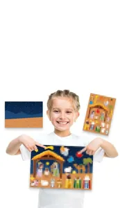 Close-up detail showing a young girl holding a Christmas nativity scene DIY sticker sheet
