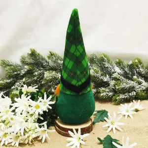 St. Patrick's Day handmade green gnome ornament with a plaid hat on a wooden base decor